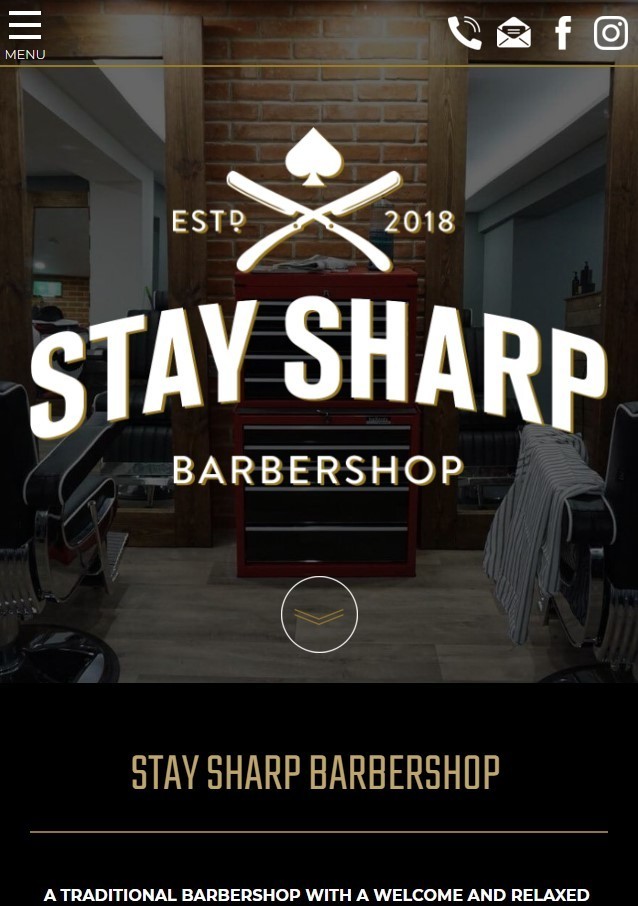 A barbershop website design shown on a mobile.