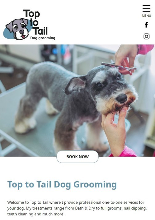 A dog grooming website design shown on a mobile device.